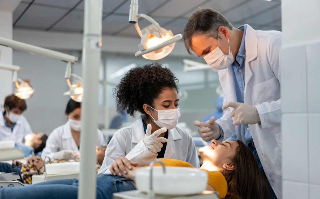 Dentist being supervised